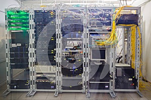 Data processing servers are located behind a glass wall in the data center. The technical platform of the telecommunications