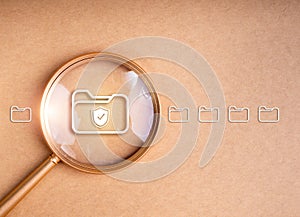 Data protection, safety information, cyber security concept. Shield icon on digital document folder file icon expanded by