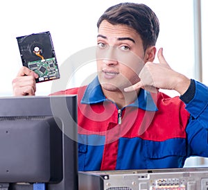 Data restoration specialist repairing corrupt hard drive