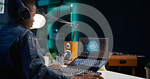 Data scientist using laptop, updating artificial intelligence machine learning