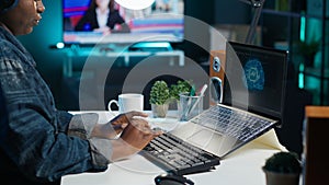 Data scientist using laptop, updating artificial intelligence machine learning