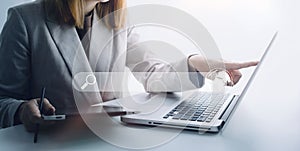 Data Search Technology Search Engine Optimization. man`s hands are using a computer notebook to Searching for information. Using