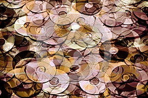 Data storage concept, layered gold and brown abstraction of DVD and CD data storage disks