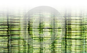 Data storage image with stacks of green gold translucent DVD and CD computer storage disks with white