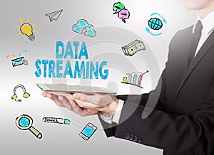 Data Streaming concept, young man holding a tablet computer