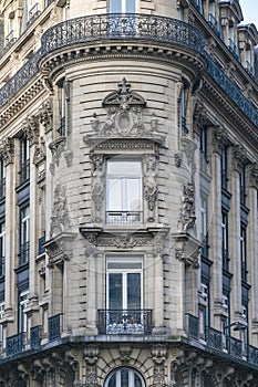 Datail of the front and narrow triangle Haussmannian architecture building on the Reaumur Boulevard in Paris