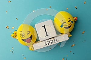 date April 1. Creative concept for April Fools' Day. Festive decor on the blue background