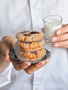 Date cookies held by a woman`s hand