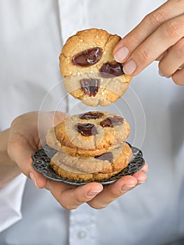 Date cookies held by a womans hand