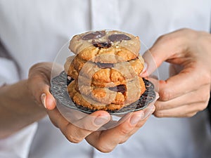 Date cookies held by a womans hand