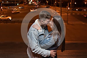 Date of couple in love against the background of the lights of the night city