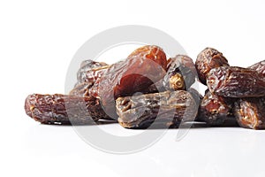 Date fruits on white background.