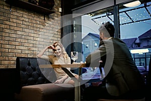 Date a loving couple. Couple in love at the restaurant. Valentines day with woman and bearded man. Proposal and