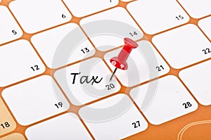 Date word tax written on a calendar