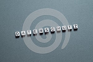 Datenschutz - word concept on cubes, text