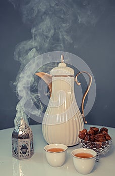 Dates, Arabic coffee and Islamic lantern bowl. Ramadan symbol