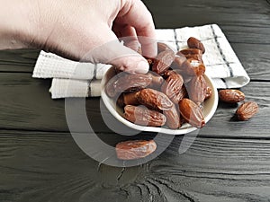 dates on a black wooden towel healthy heap nutrition
