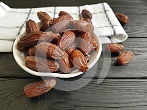 dates on a black wooden towel healthy ingredient heap nutrition