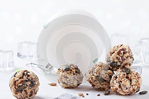 Dates energy homemade no cooked organic seeds nuts vegan oatmeal balls white winter background