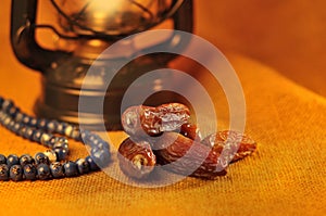 Dates, Islamic rosary and Kandeel- a vintage lamp