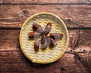 Dates or kurma on a wooden table