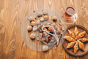 Dates, rosaries and baklava. Ramadan. Selective focus