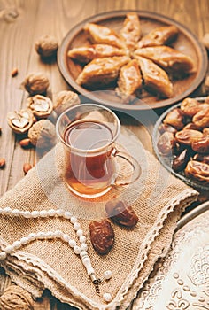 Dates, rosaries and baklava. Ramadan. Selective focus