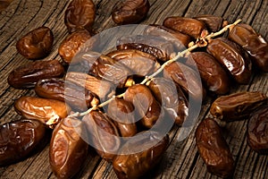 Dates tropical fruit branch on old wooden