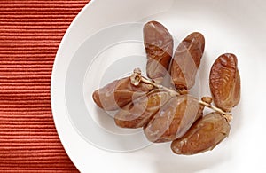 Dates on white plate