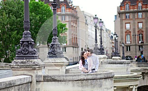 Dating couple is kissing tenderly in Paris