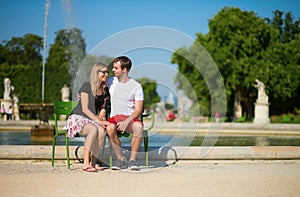 Dating couple in the Tuileries garden of Paris