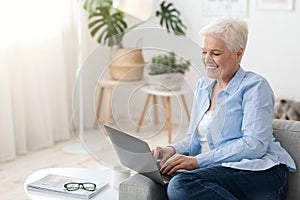 Dating Websites For Seniors. Beautiful Elderly Lady Typing On Laptop At Home