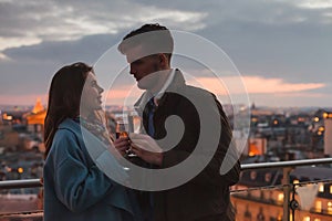 dating, young couple drinking champagne in Paris by night, France