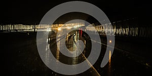 Datk wet highway at night with bokeh lights