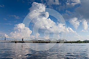 Daugava river in Riga, latvia, with dzelzcela tilts or Riga Railway Bridge during a sunny afternoon. Daugava is a major river of photo