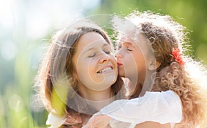 Daugher kissing her mother