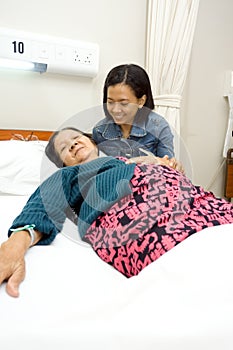 Daughter accompany sick old mother
