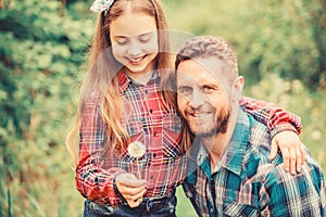 Daughter and father with dandelion. little girl and happy man dad. earth day. spring village country. ecology. Happy