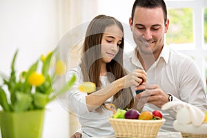 Daughter and father having fun with Easter eggs