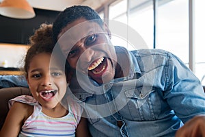 Daughter and father at home. photo