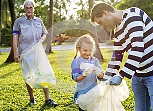 Daughter and Father separating trash for recycle photo