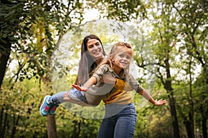 Daughter fly in Moms arms.