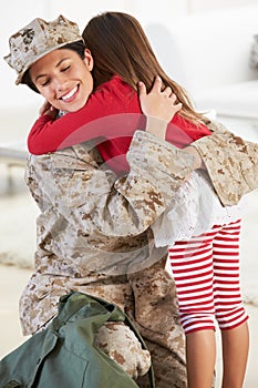 Daughter Greeting Military Mother Home On Leave