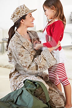 Daughter Greeting Military Mother Home On Leave