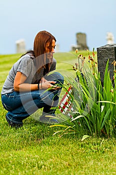 A Daughter at her Fathers Grave Site