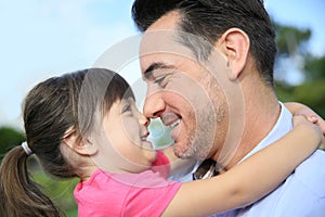 Daughter hugging her father