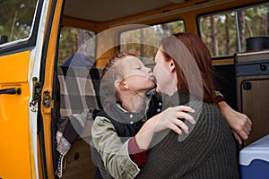 Daughter kisses and embracing her mother