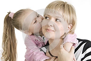 Daughter kissing her mother.