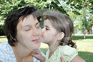 Daughter kissing her mother