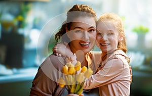 daughter and mom with flowers